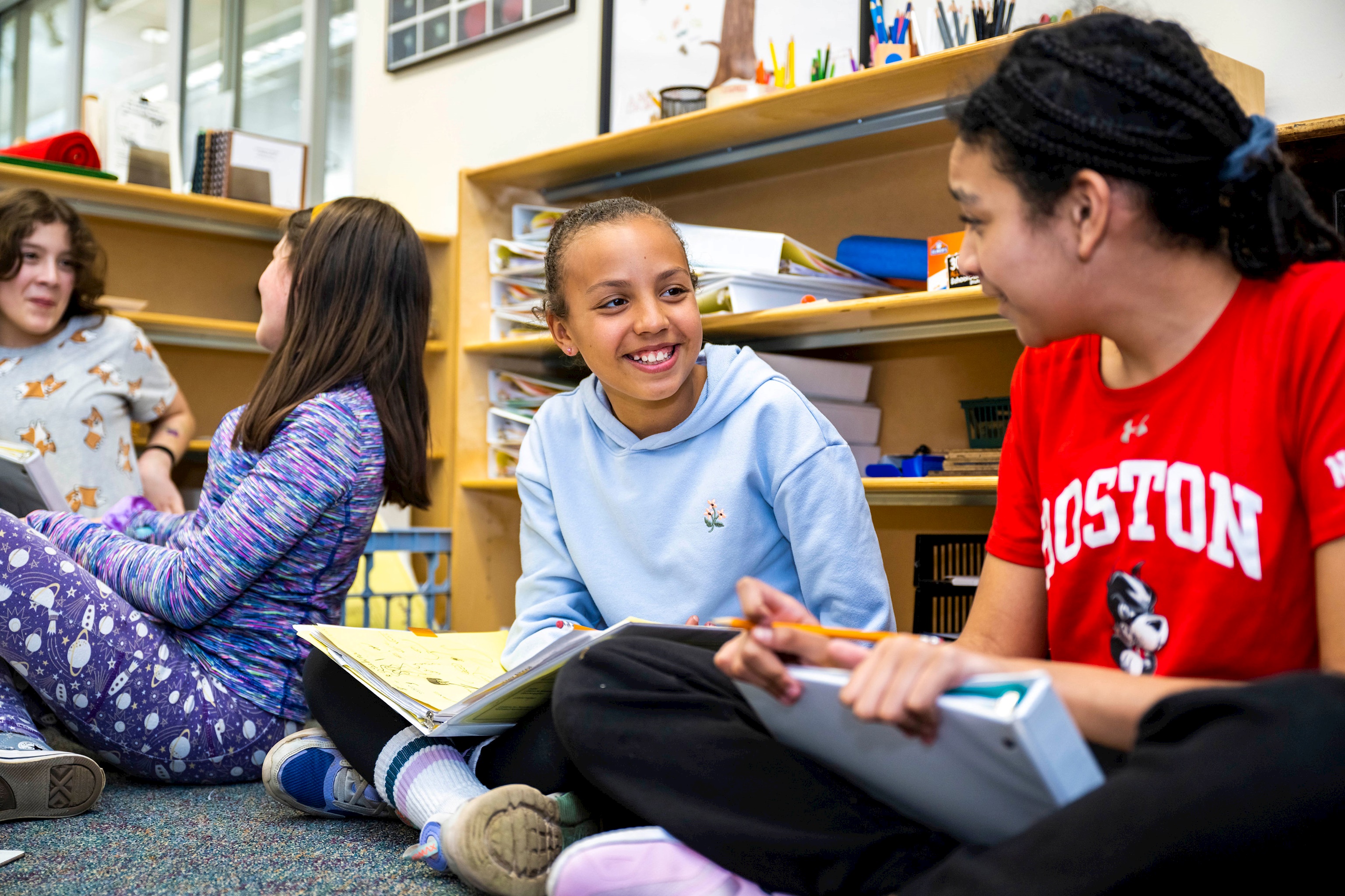 LMS upper elementary students freelearning on the classroom floor