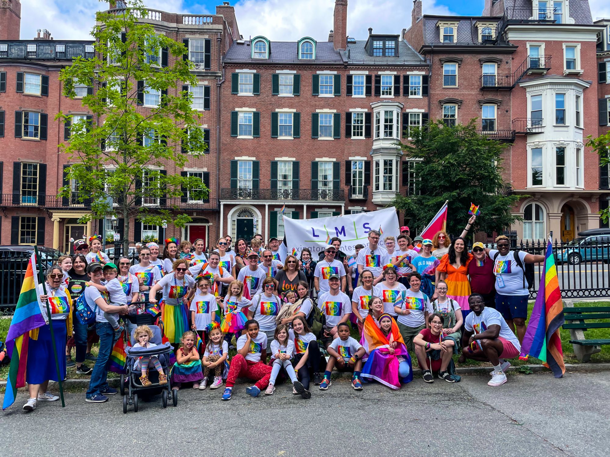 Group of LMS students, teacher and parents celebrating Pride Day