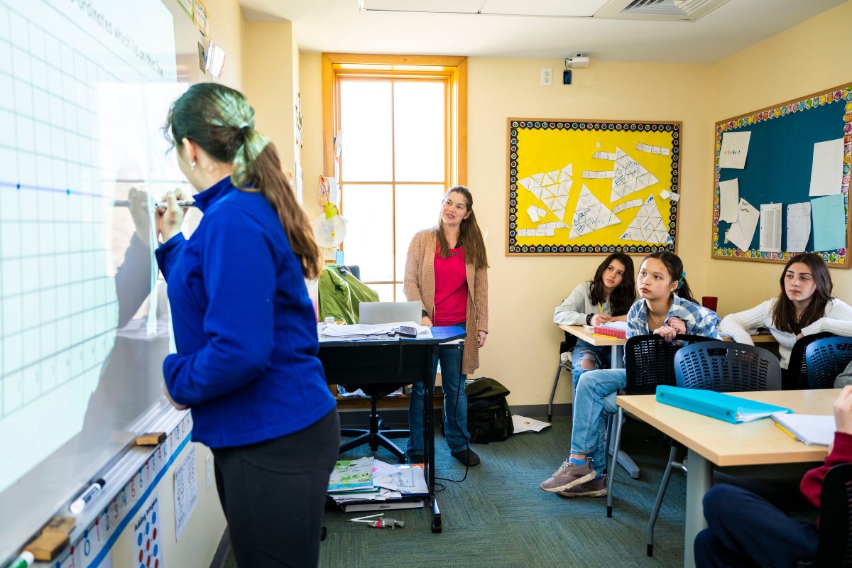 Group of middle school students learning in the classroom